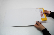 Einlegen in Einzelverpackung